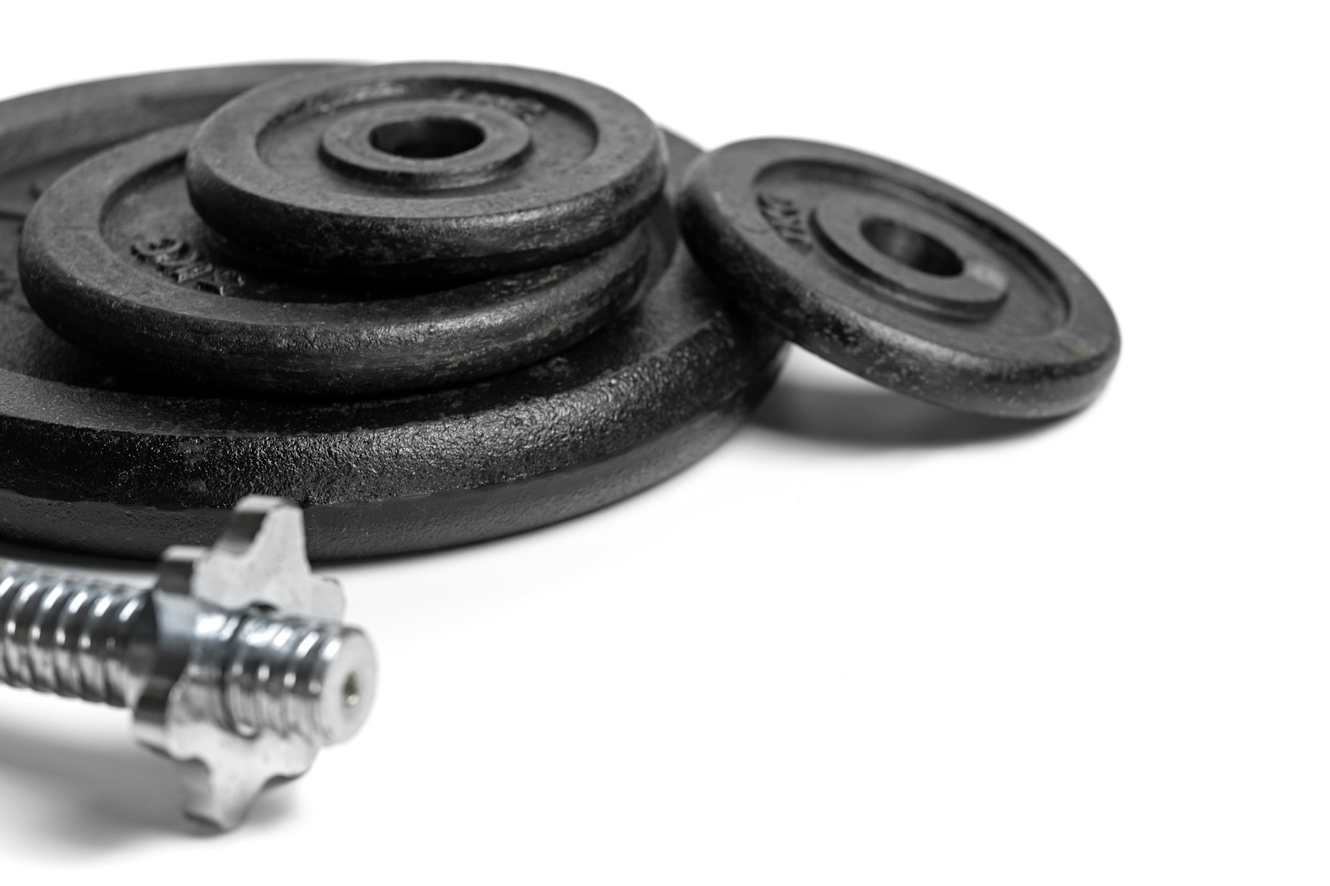 a couple of screws and a nut on a white surface